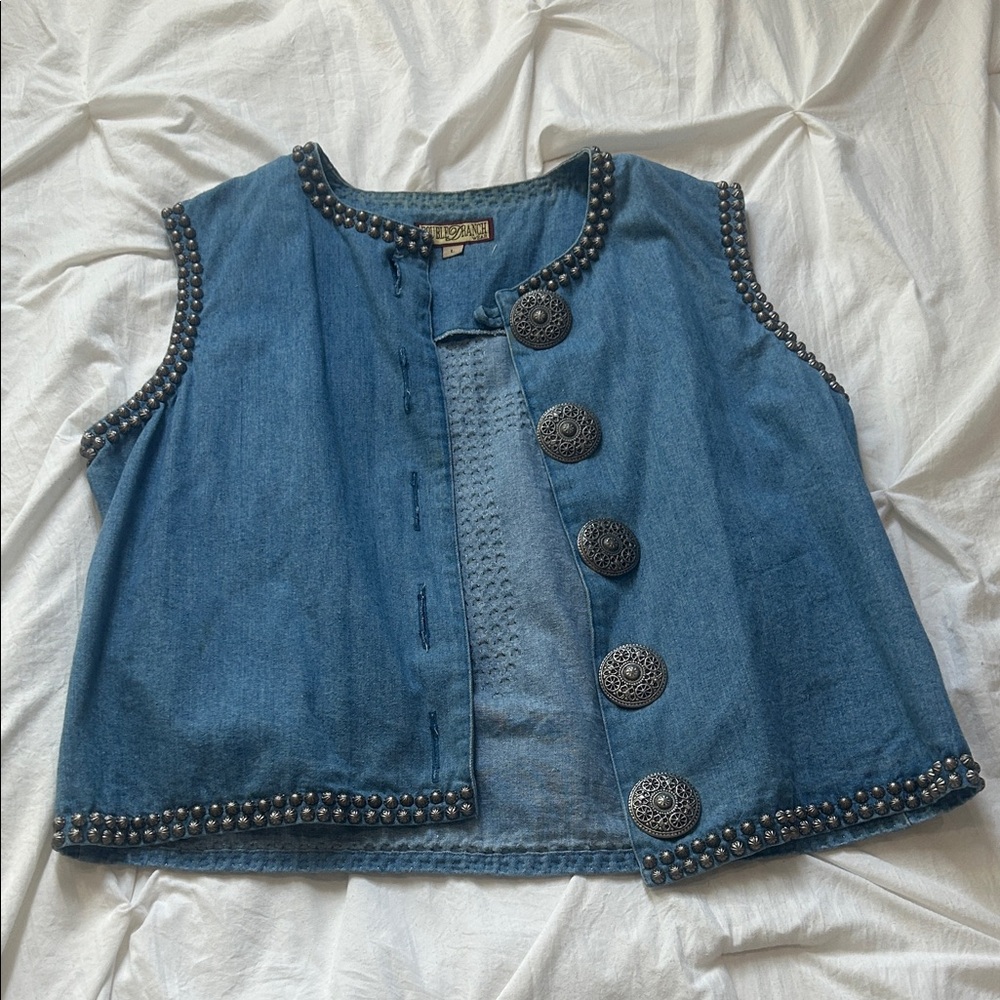 Vintage Double D Ranch denim studded vest with concho closures.